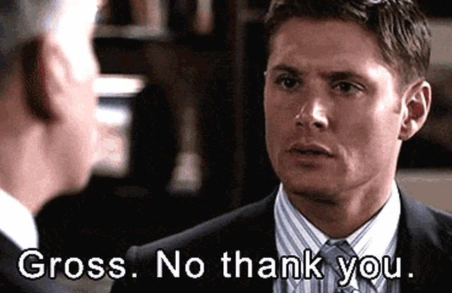 A suited man stares forward uneasily with the caption “Gross. No thank you.”