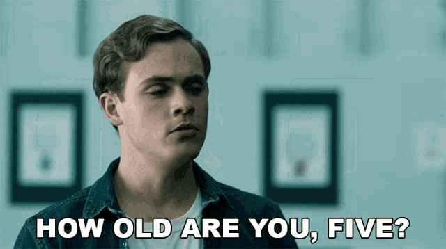 a young man in a denim shirt says how old are you five