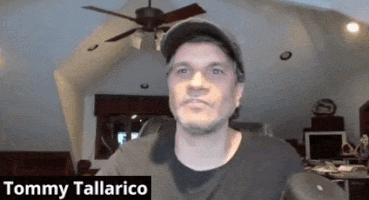 a man wearing a baseball cap and a black shirt is named tommy tallarico
