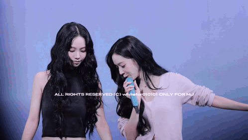 two women are standing next to each other with the words all rights reserved on the bottom