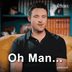 a man in a black shirt is sitting on a yellow couch and says oh man ...