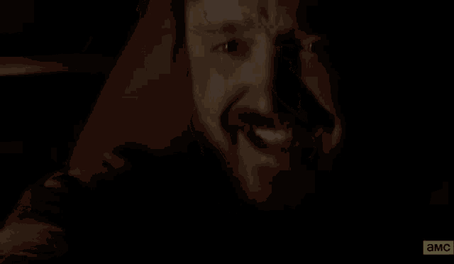 a close up of a man 's face with blood on it .