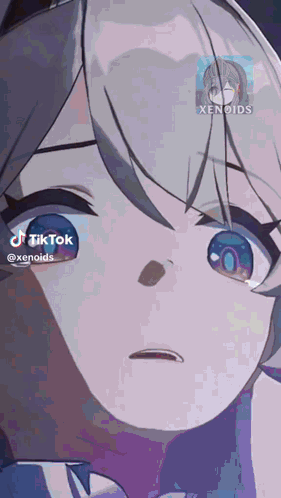 a close up of a girl 's face with a tiktok icon next to it