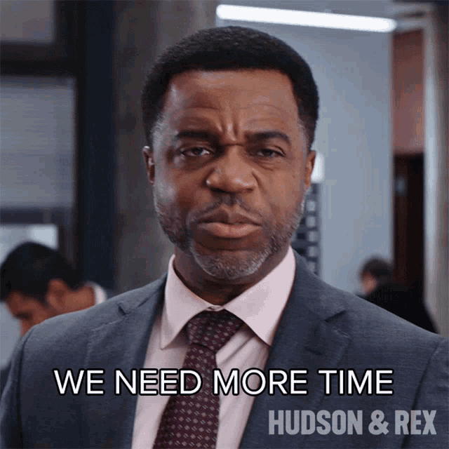 a man in a suit says we need more time