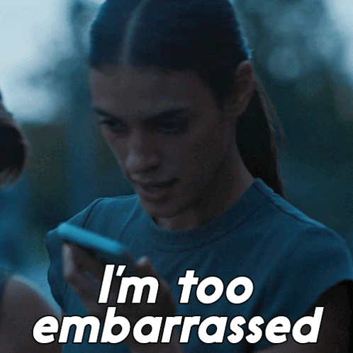 Woman holds a blue cup with the caption “I’m too embarrassed.”
