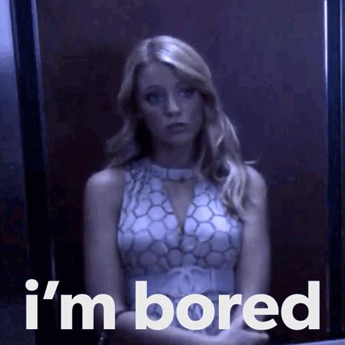 a woman sitting in an elevator with the words " i 'm bored " on the bottom