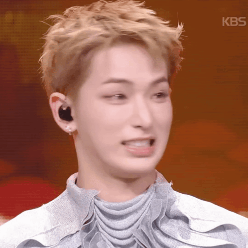 a close up of a person 's face with the kbs logo on the bottom