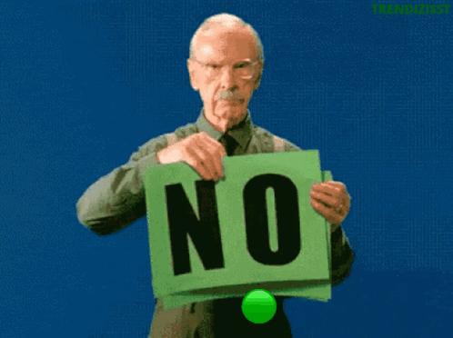A bald green-skinned character holds a large green sign reading “NO.”