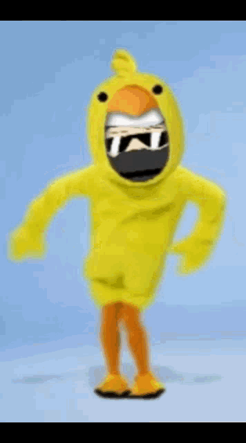 a yellow chicken mascot is dancing with sunglasses on