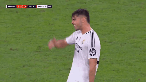 a soccer player wearing a fly emirates jersey celebrates