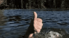 A person in water gives a thumbs-up while appearing to sink.
