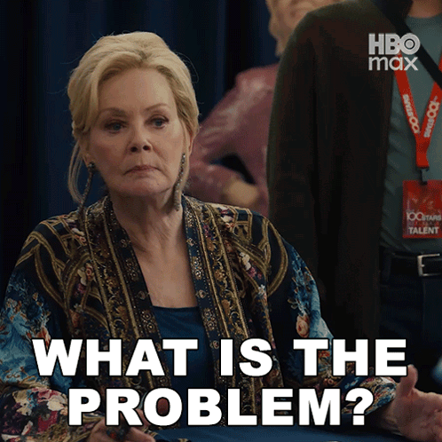 a woman with a lanyard that says 100 years talent is asking what is the problem