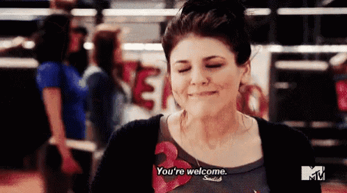 A woman smiles faintly with the subtitle “You're welcome.”