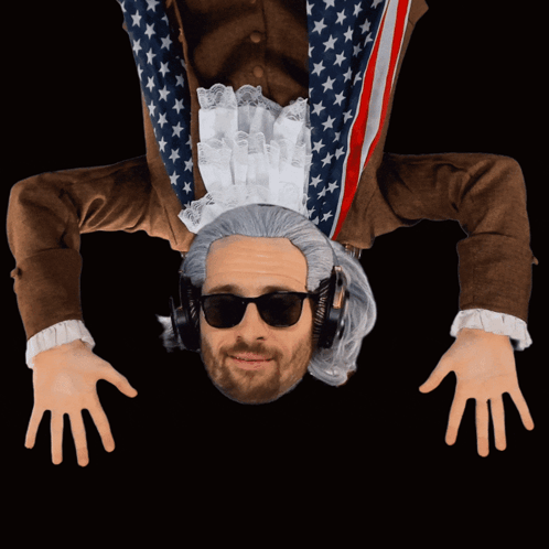 a man is upside down wearing headphones and a wig