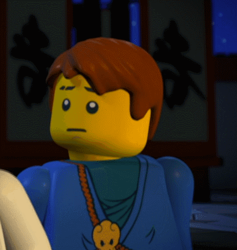 a close up of a lego figure with a skull on his shoulder