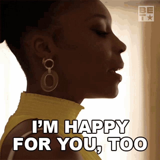 a woman in a yellow top is saying i 'm happy for you too