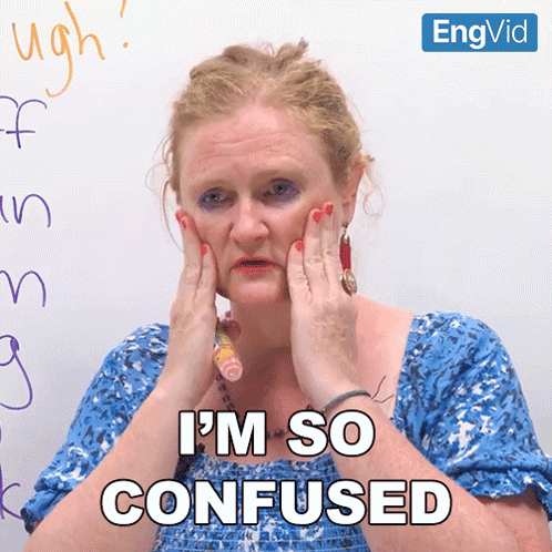a woman covering her face with her hands and the words i 'm so confused