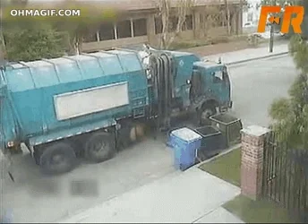 A garbage truck misses a trash can during collection.