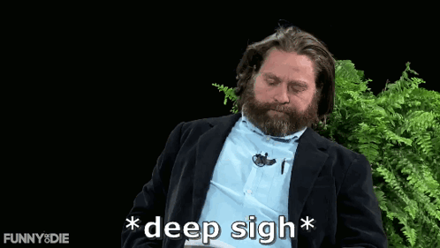 Zach Galifianakis sits outdoors between ferns with “*deep sigh*” on screen.