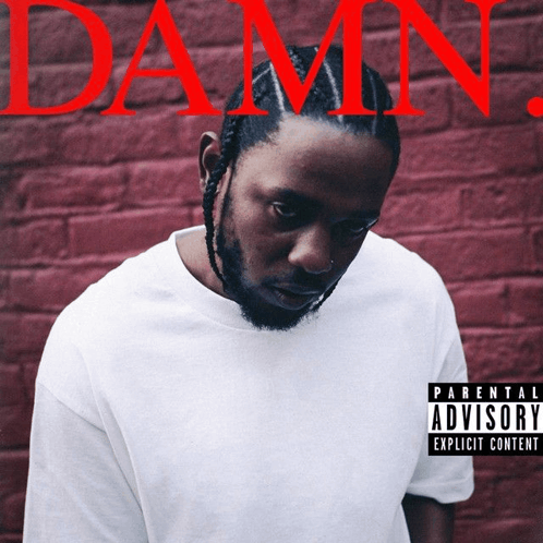 a man in a white shirt with a parental advisory on it