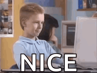 A child at a computer gives a thumbs-up with a large “NICE” caption.