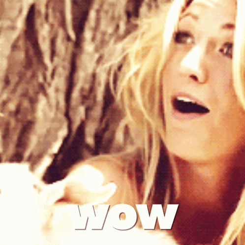 a woman with a surprised look on her face and the word wow on the bottom right