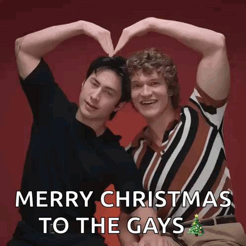 two men are making a heart with their hands and the words merry christmas to the gays