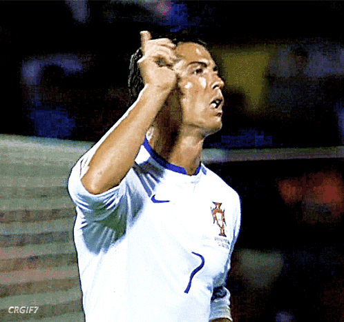 a soccer player with the number 7 on his jersey giving a thumbs up