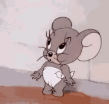 Jerry Mouse stands with hands clasped and a skeptical expression.