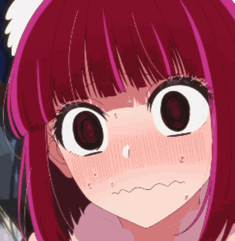 a close up of a girl with red hair making a funny face