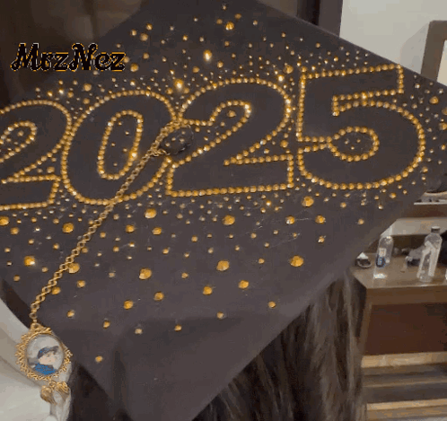 a black graduation cap with the year 2025 written on it