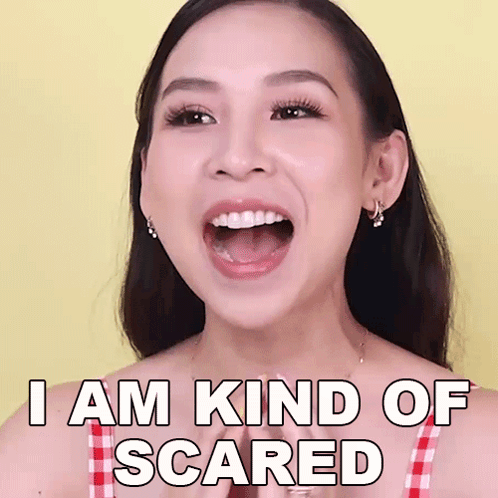 a woman with her mouth open and the words i am kind of scared on her face