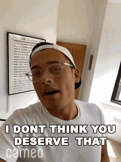 a man wearing glasses and a baseball cap says `` i dont think you deserve that cameo ''