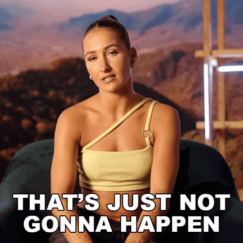 a woman is sitting on a couch with the words that 's just not gonna happen behind her