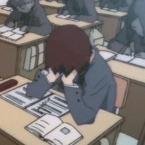 Lain sits at a crowded school desk with her head in her hands.