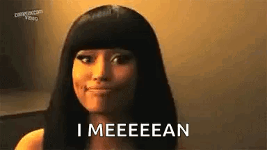 Nicki Minaj looks toward the camera with the caption “I MEEEEAN.”