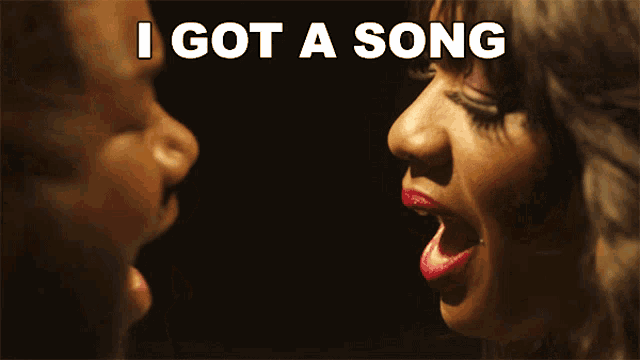 a woman singing into a microphone with the words " i got a song " above her