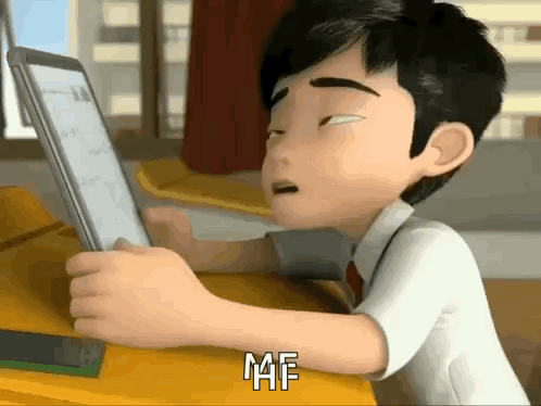 a cartoon boy is sitting at a desk looking at a tablet and saying maf .