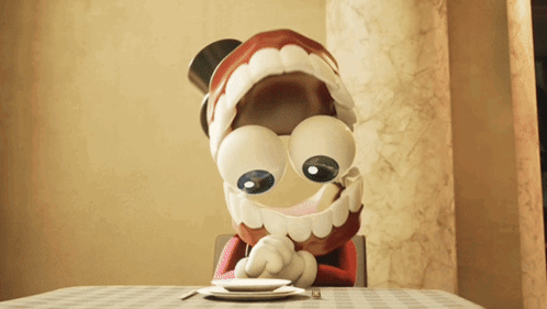 a cartoon character sitting at a table with a plate and fork