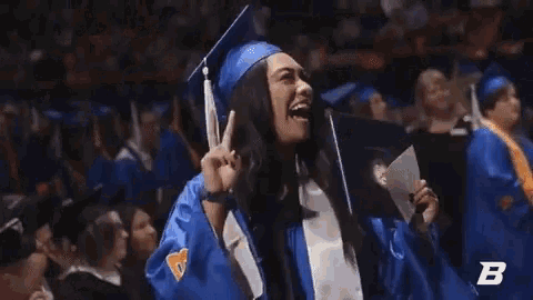 a woman in a graduation cap and gown is holding a diploma with the letter b in the corner