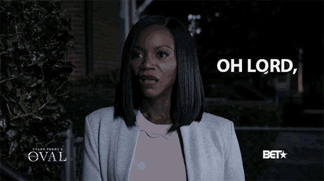 a woman says oh lord in front of a sign that says oval