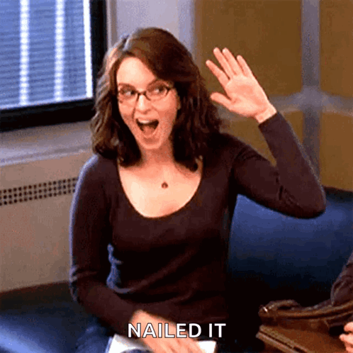 Woman gives herself a high five, captioned “NAILED IT.”
