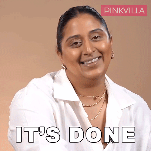 a woman in a white shirt is smiling with the words it 's done behind her