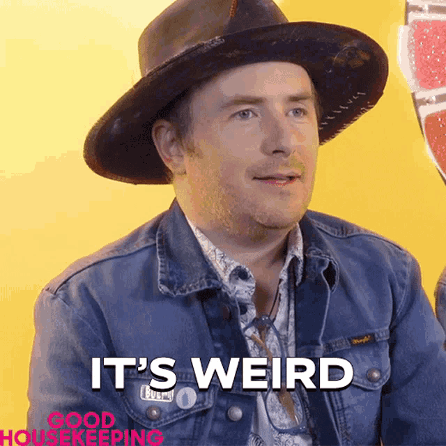 a man wearing a cowboy hat and a denim jacket says it 's weird