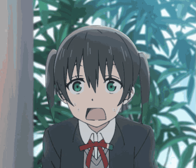 a girl with a surprised look on her face is wearing a red bow tie