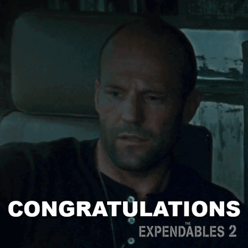 a man is sitting in a car with the words congratulations written below him