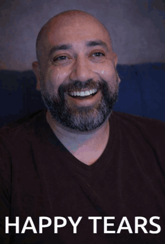 A smiling bald man appears with the caption “HAPPY TEARS.”