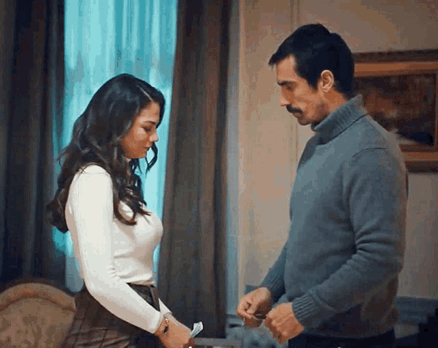 a man and a woman standing next to each other