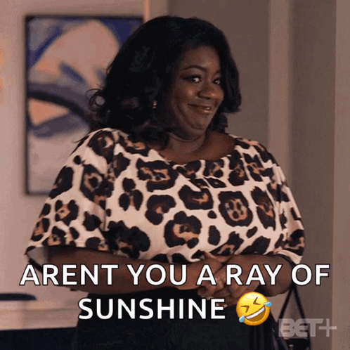 a woman in a leopard print top is smiling and says " aren t you a ray of sunshine "