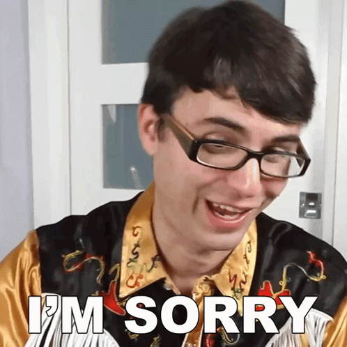 a man wearing glasses and a shirt that says i 'm sorry on it